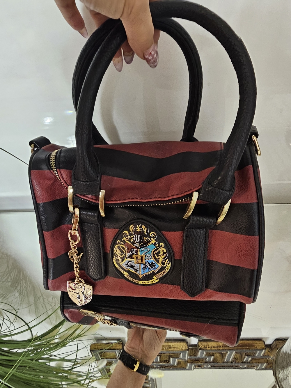 Striped Burgundy and Black Satchel with Crest Accent